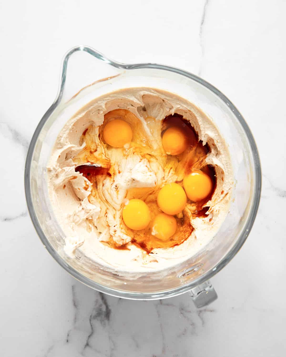 creamed butter and sugar with eggs and vanilla in a mixing bowl.