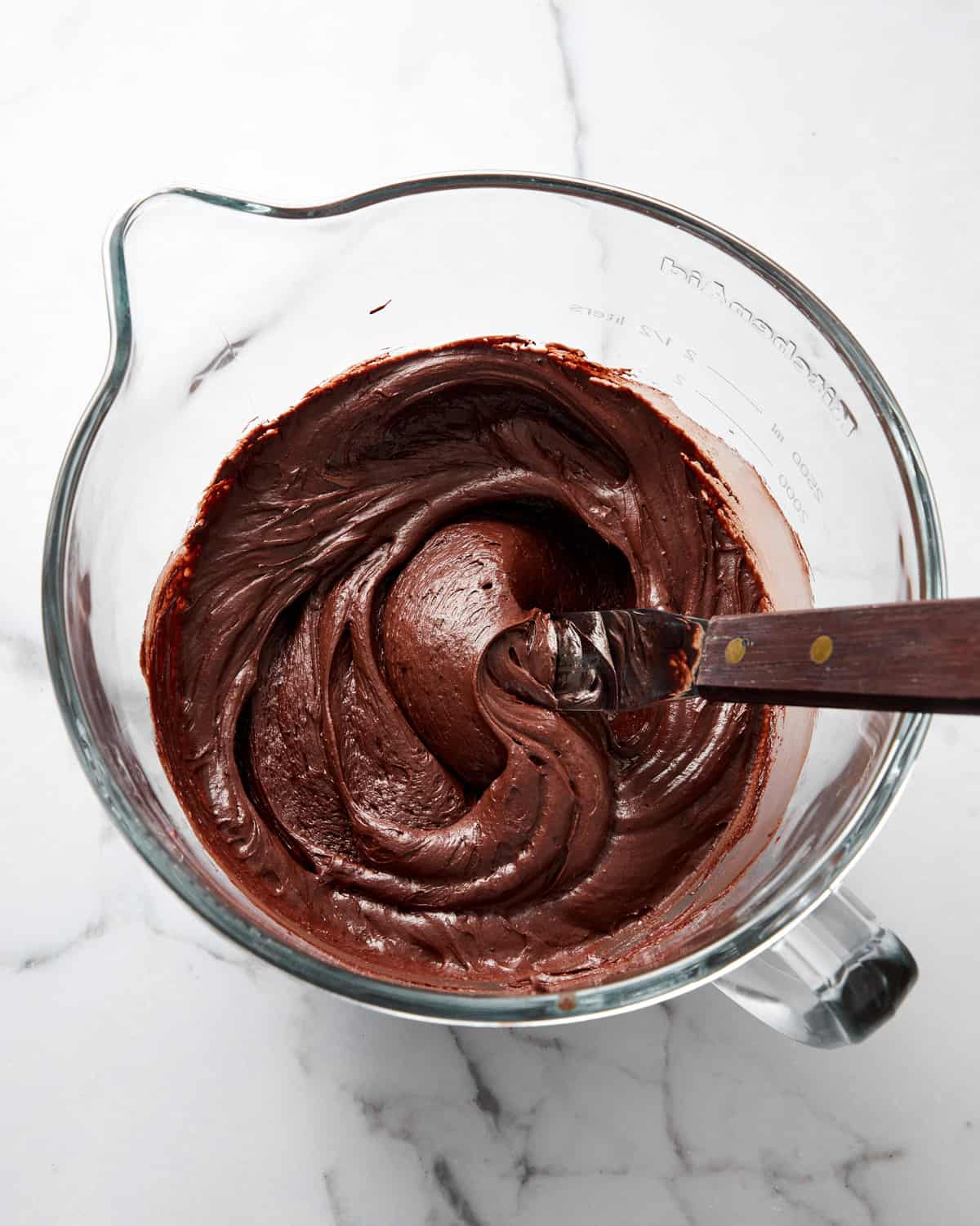 chocolate cream cheese frosting in a mixing bowl.