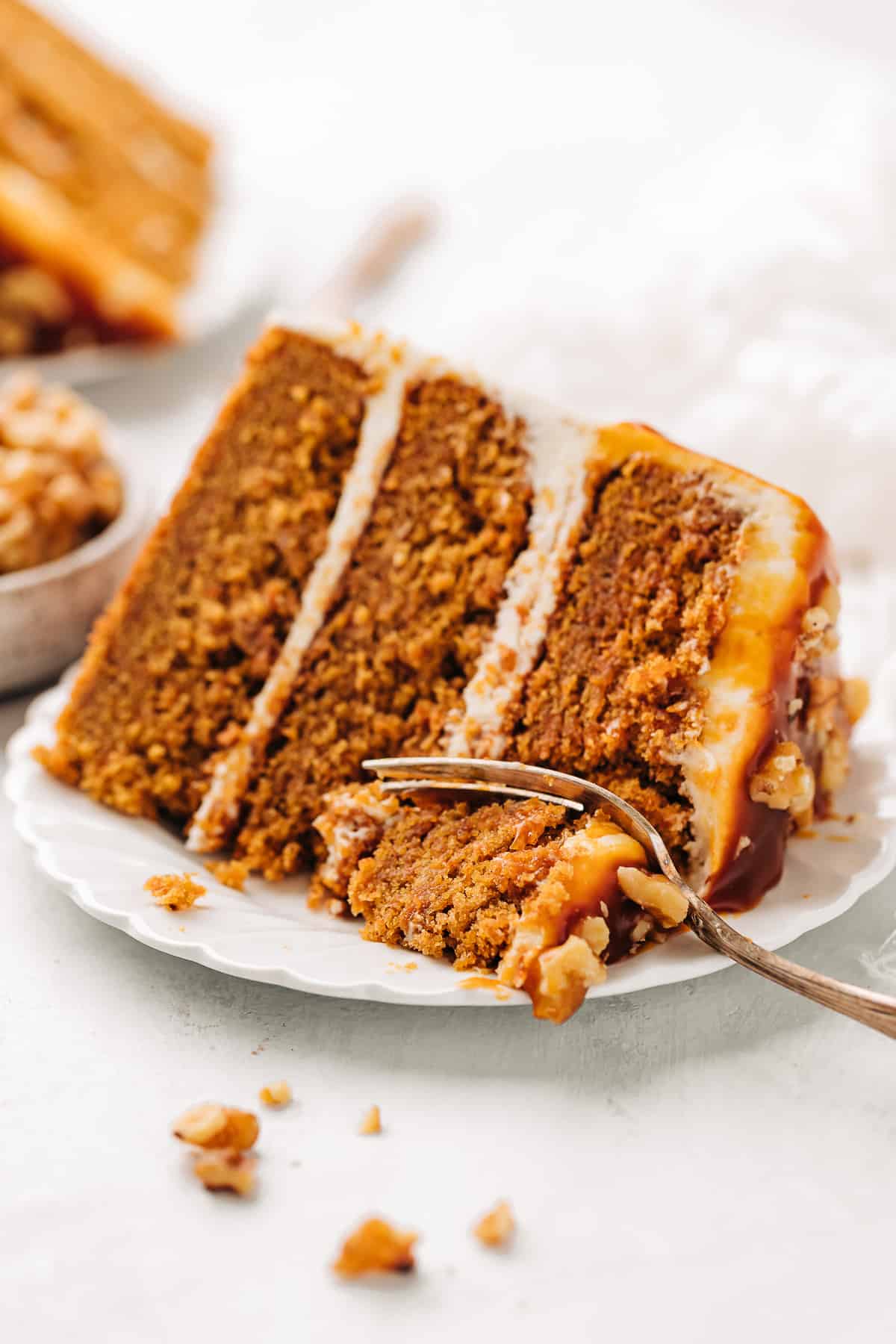 Slice of carrot cake on a plate.