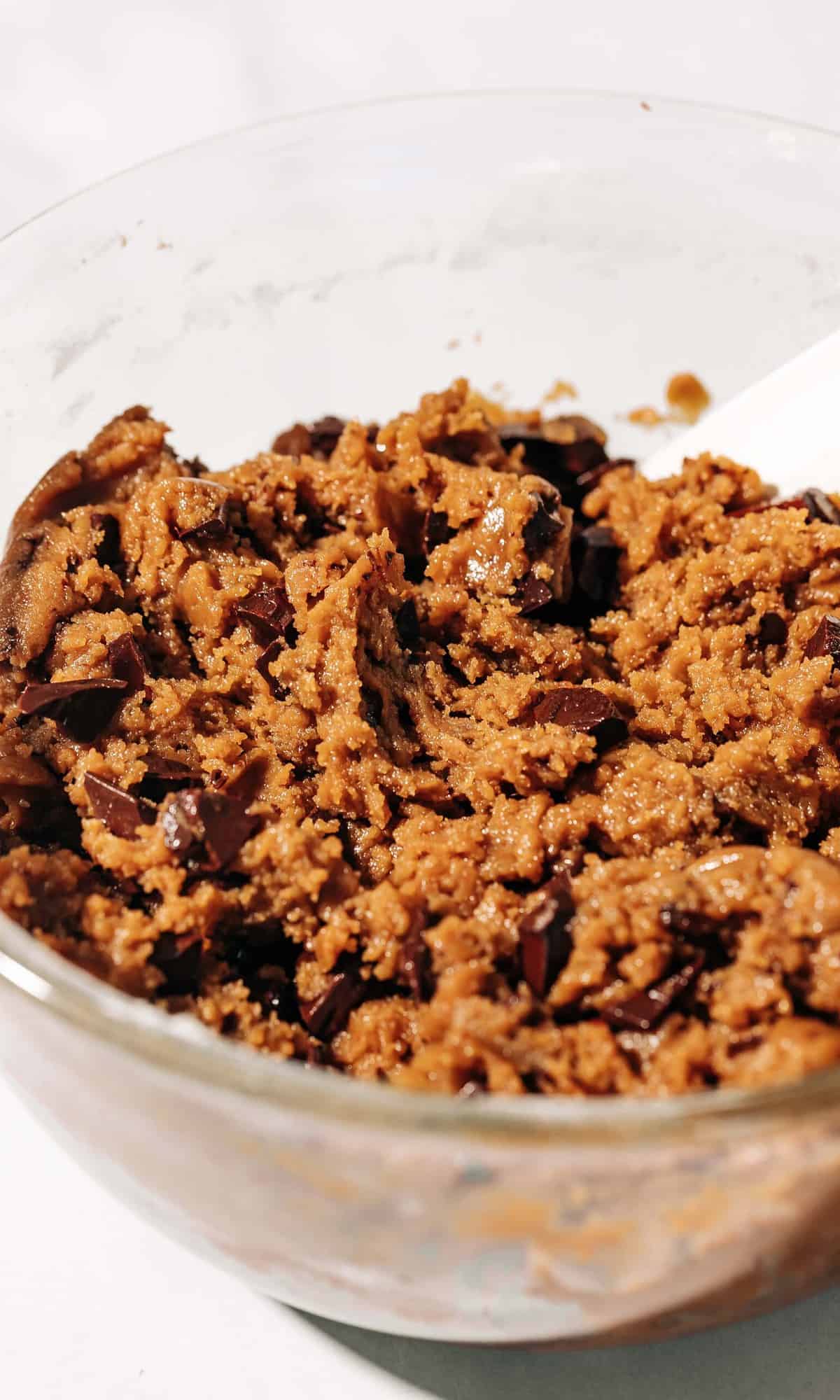 chocolate chunk tahini cookie dough in a bowl.