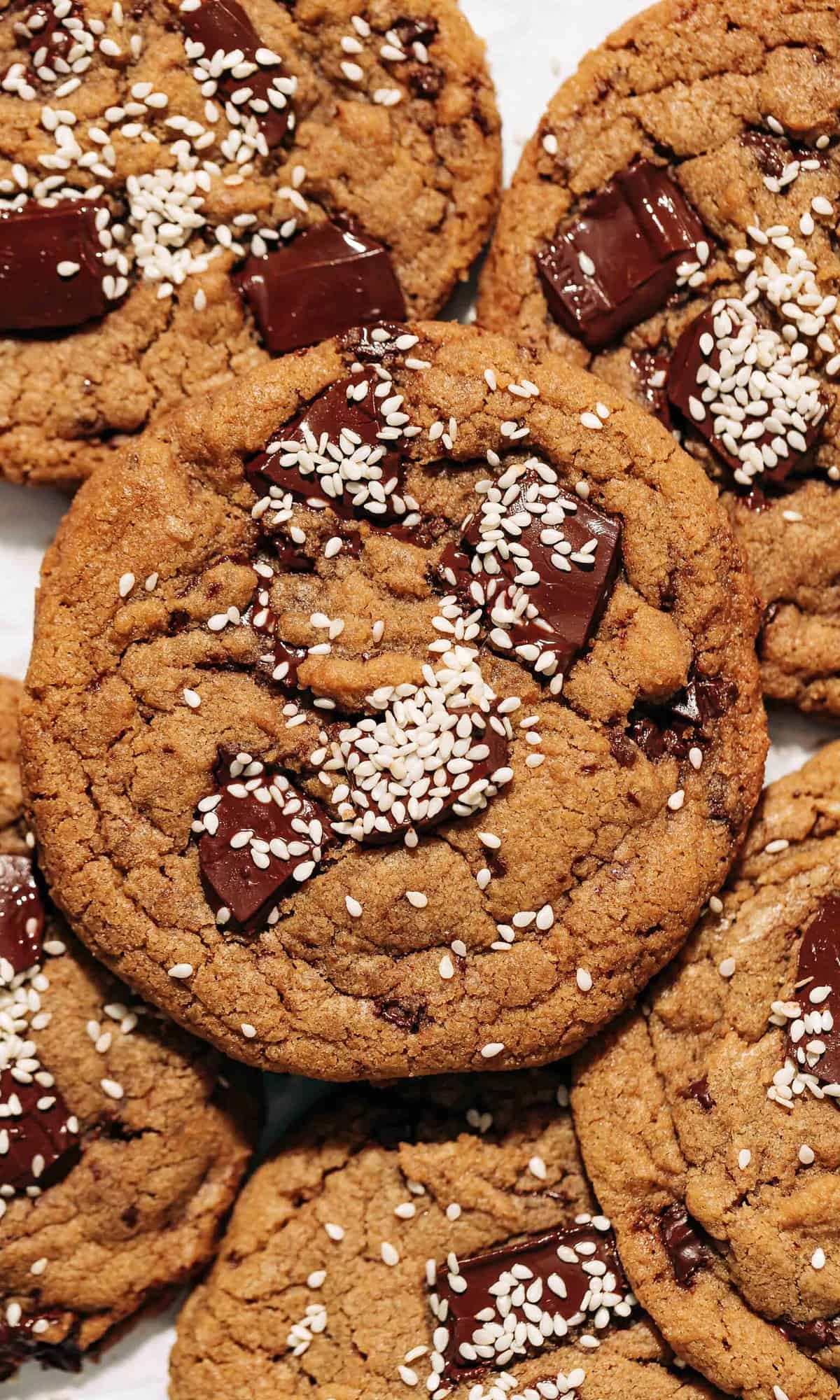 tahini chocolate chip cookies on parchment paper.