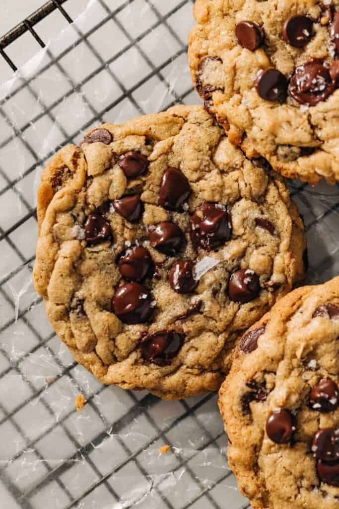 peanut butter oatmeal chocolate chip cookies on a wire rack.