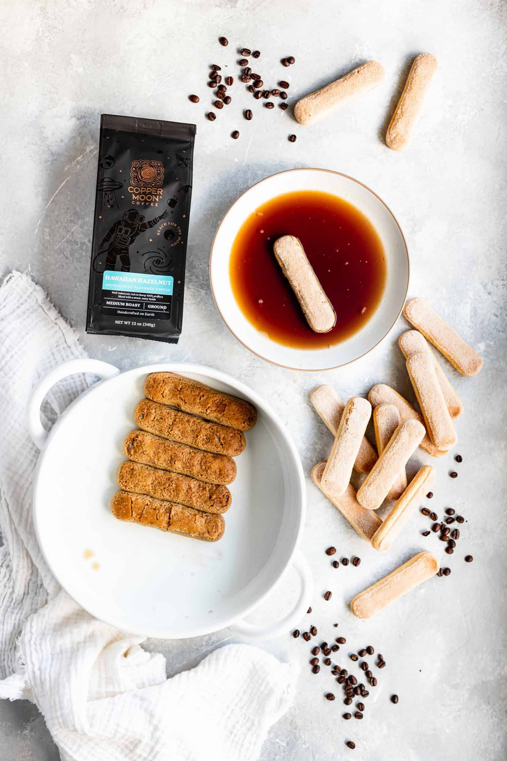 Ladyfingers soaking in coffee