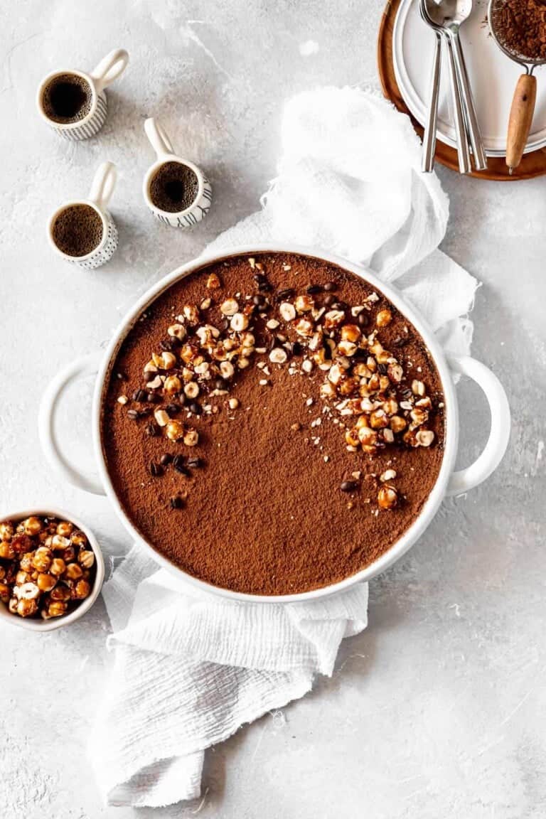 tiramisu in a baking dish with candied hazelnuts