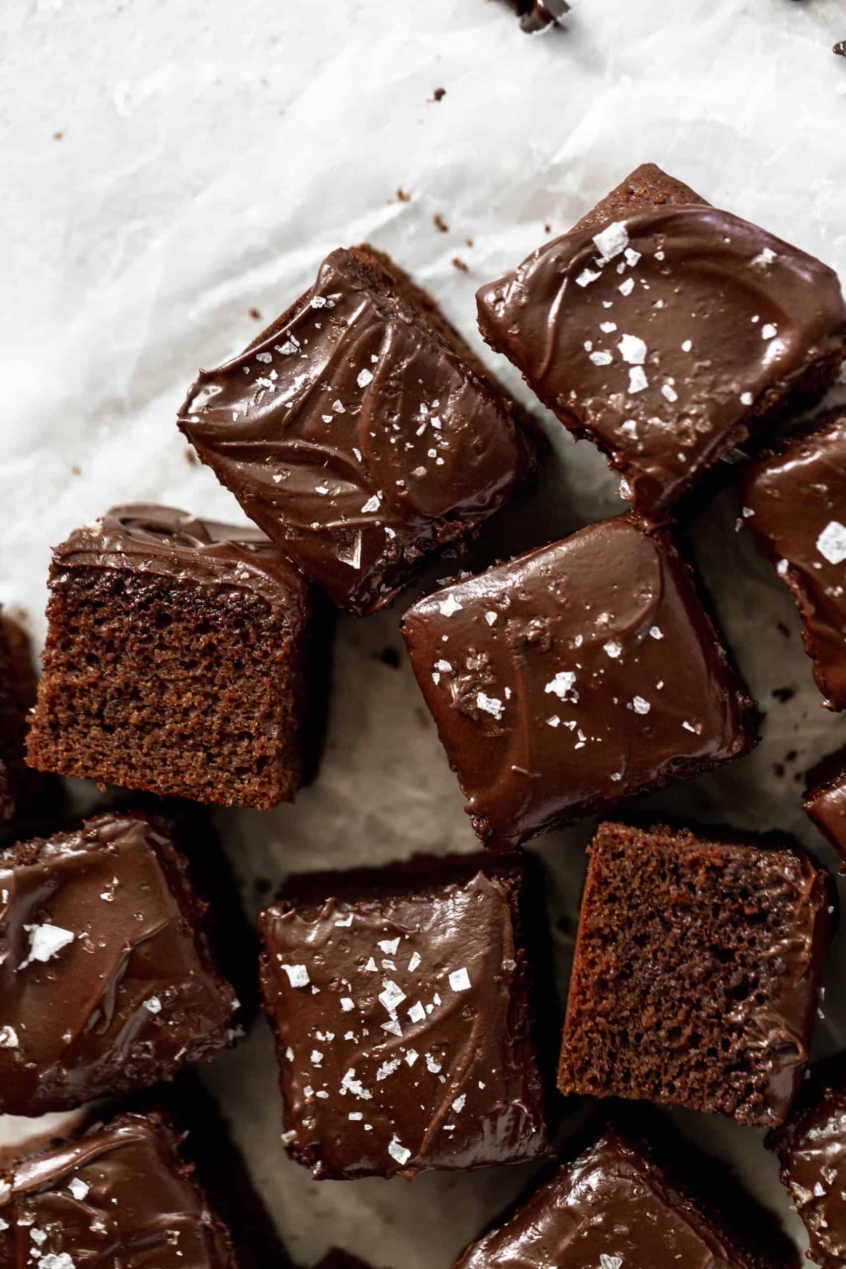 pieces of chocolate cake with chocolate buttercream frosting and sea salt