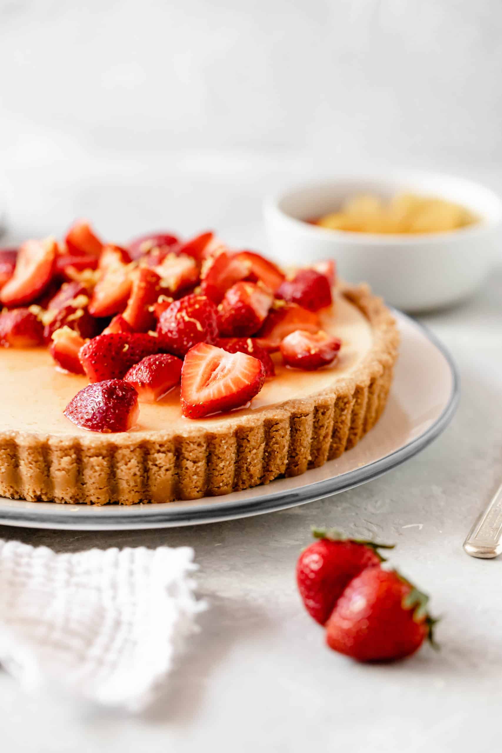 Lemon tart with sliced strawberries