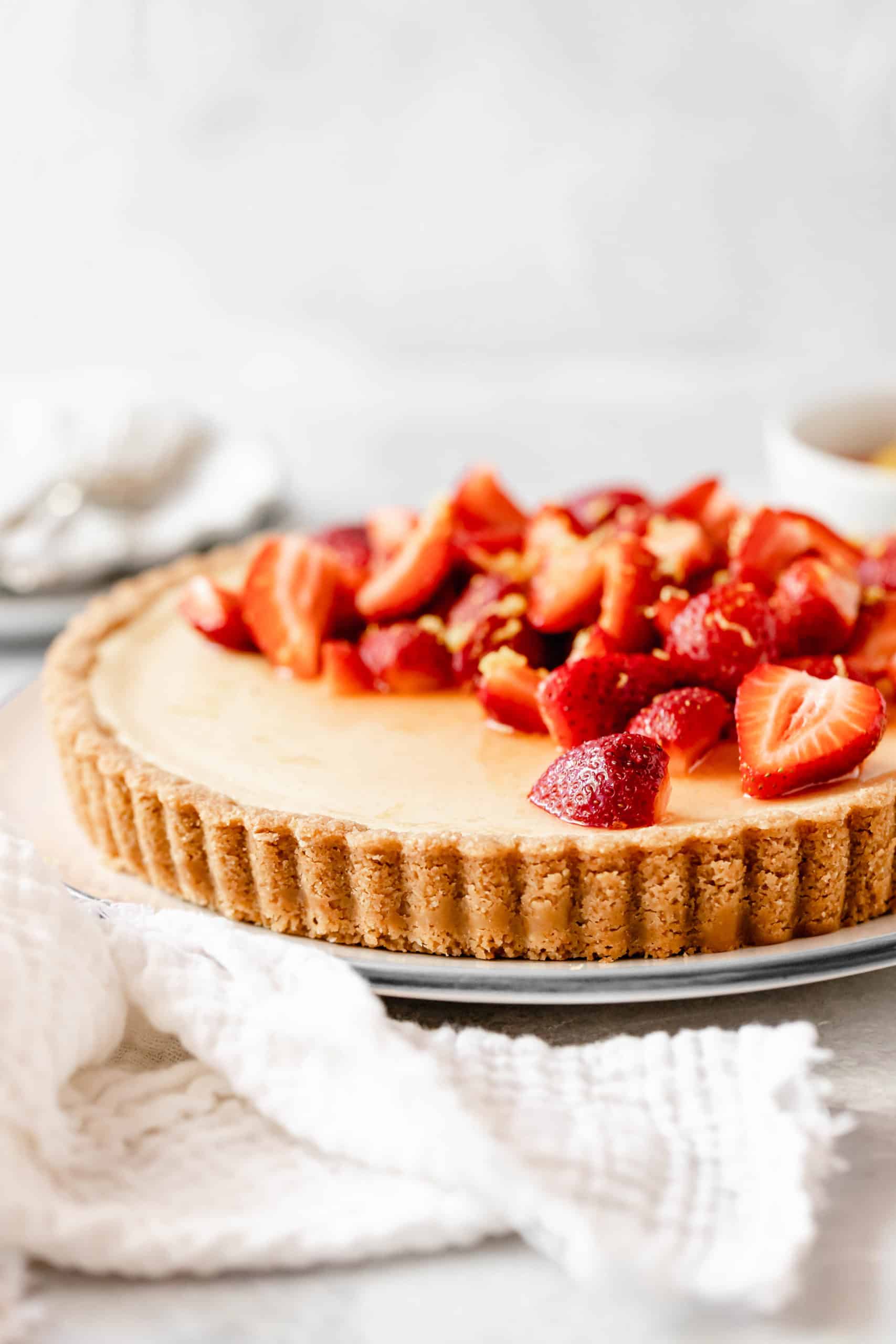 Lemon tart with sliced strawberries