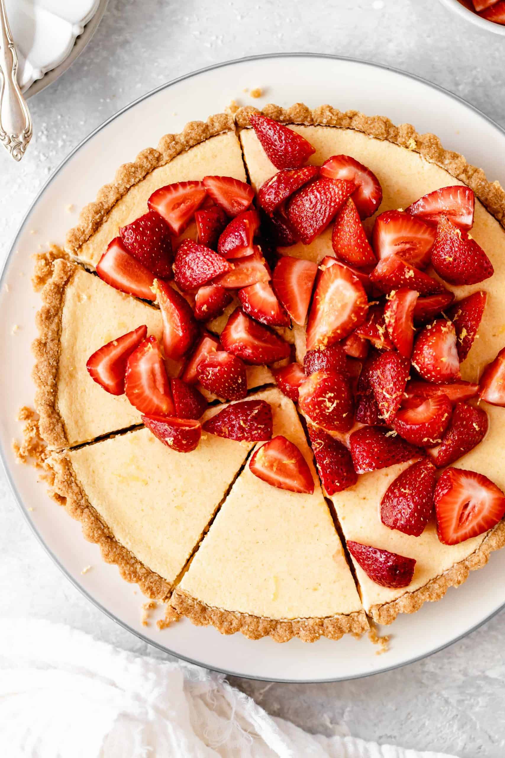 Sliced lemon tart with strawberries