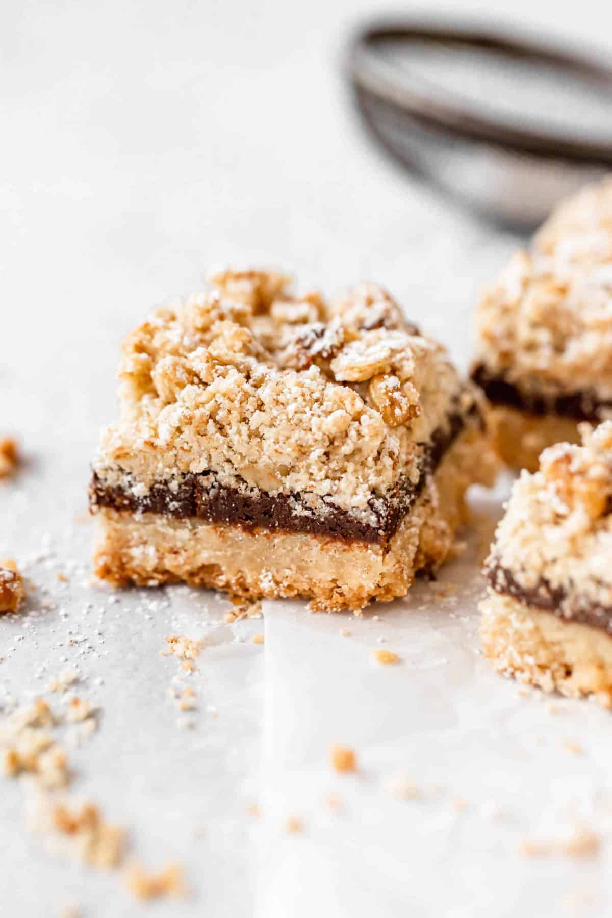 chocolate crumb bars on parchment paper