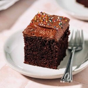 Slice of chocolate cake on a plate.