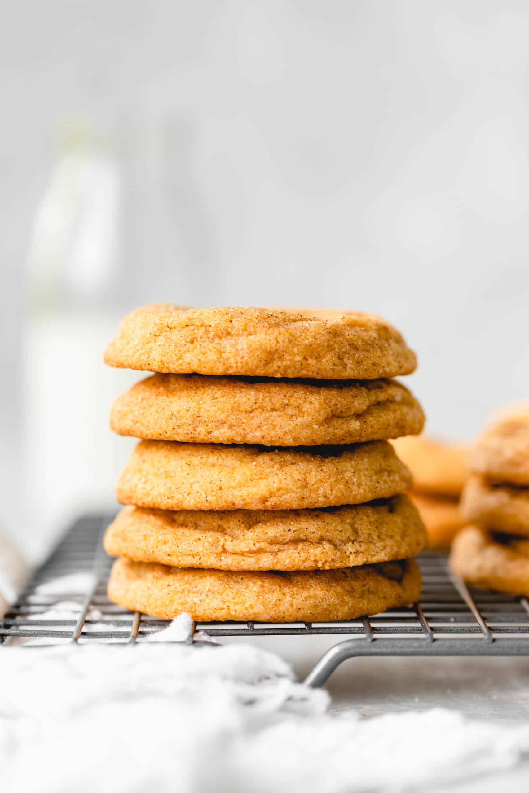 stack of pumpkin snickerdoodles on a wire rack