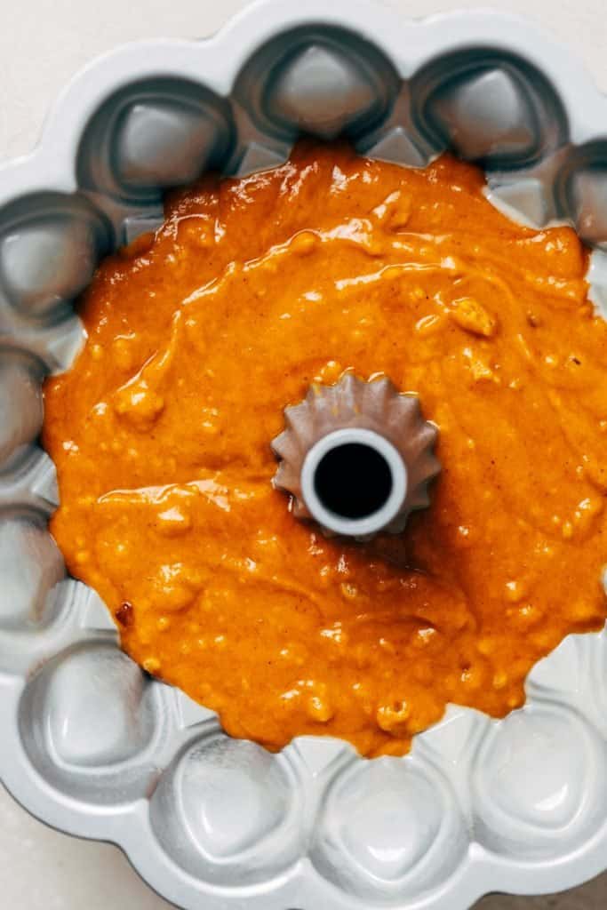 pumpkin cake batter in a bundt pan