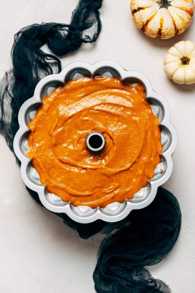 pumpkin cake batter in a bundt pan