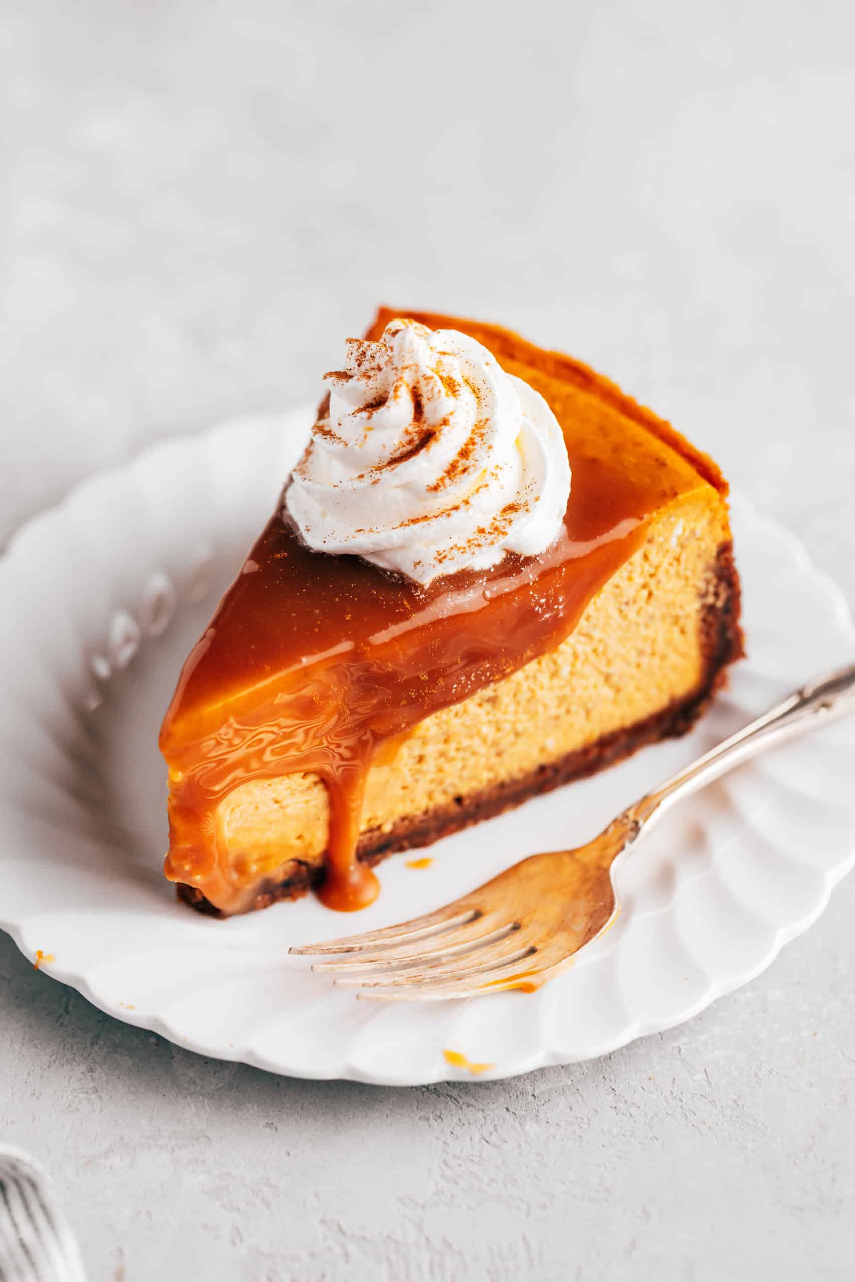 Slice of pumpkin cheesecake on a plate