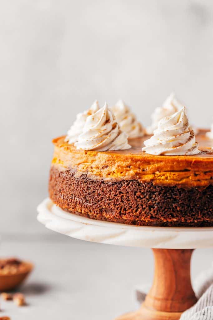 pumpkin cheesecake on a cake stand