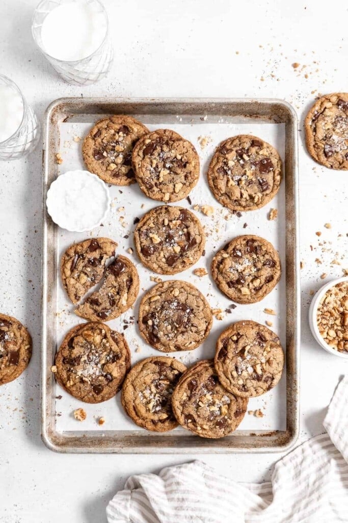 chocolate chip walnut cookies on a baking sheet