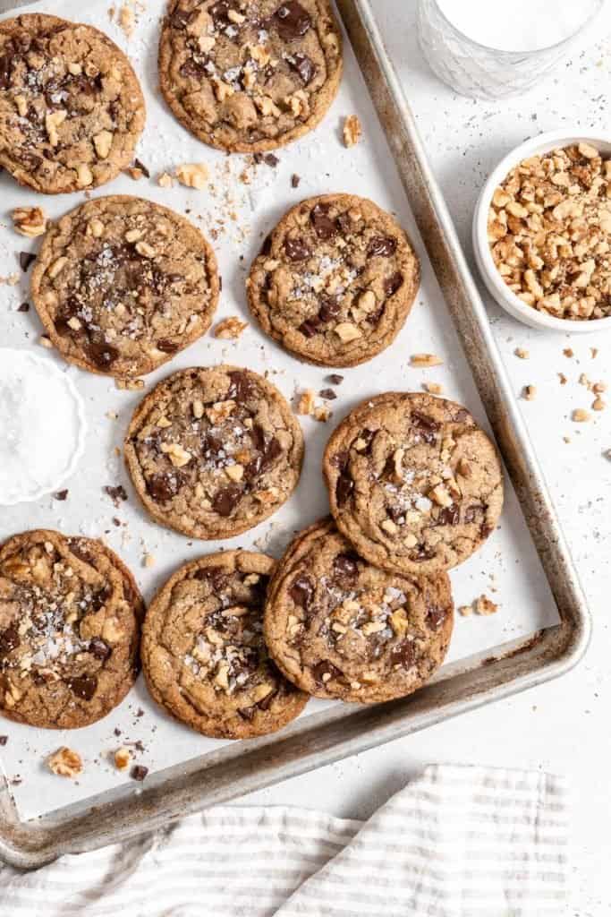 chocolate chip walnut cookies on a baking sheet