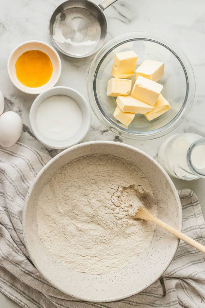cinnamon roll ingredients on a marble surface