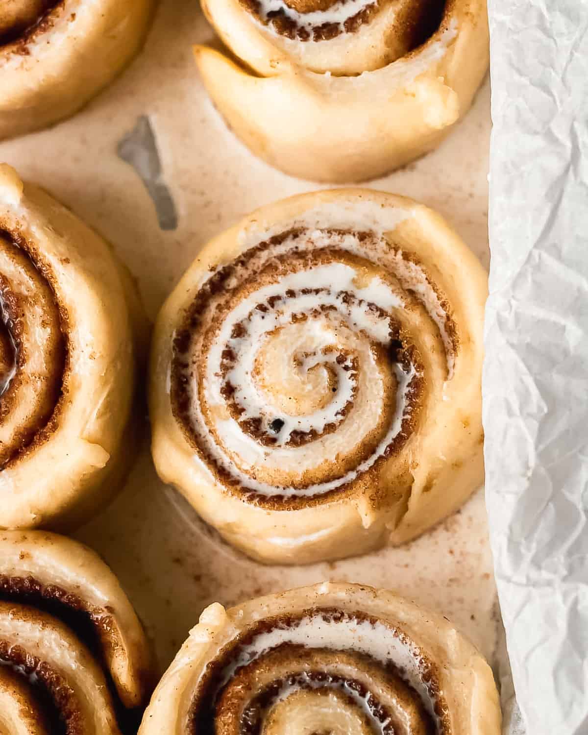 heavy cream poured over unbaked cinnamon rolls.