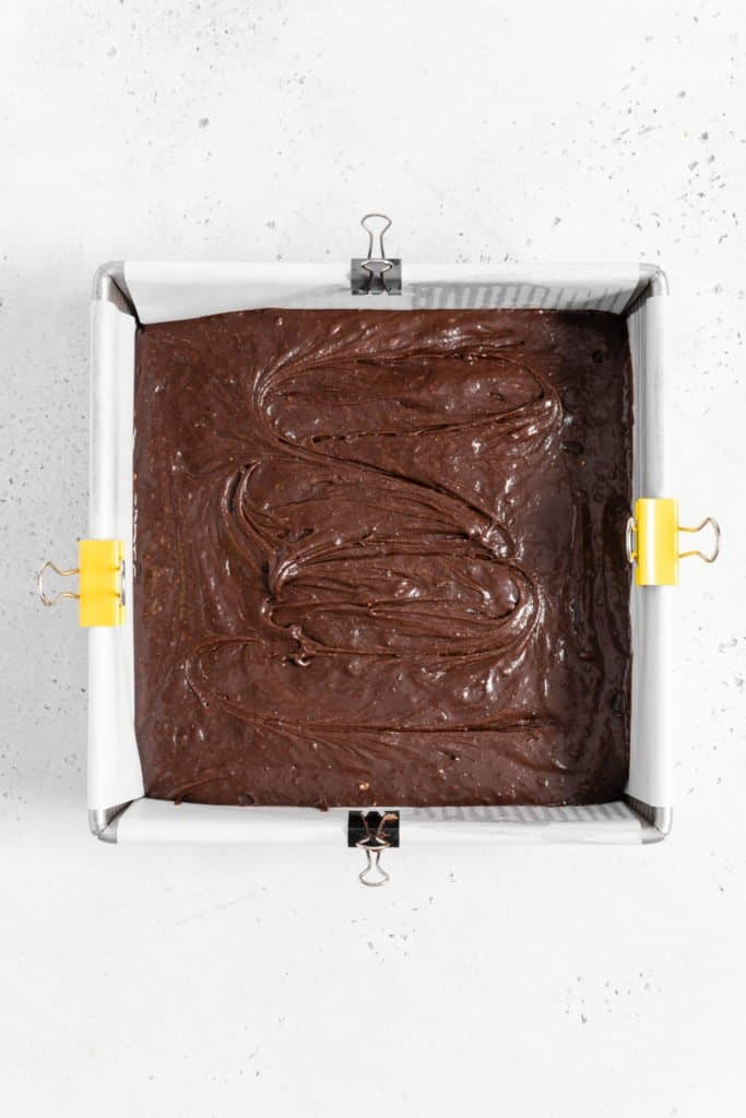 brownie batter in a square pan