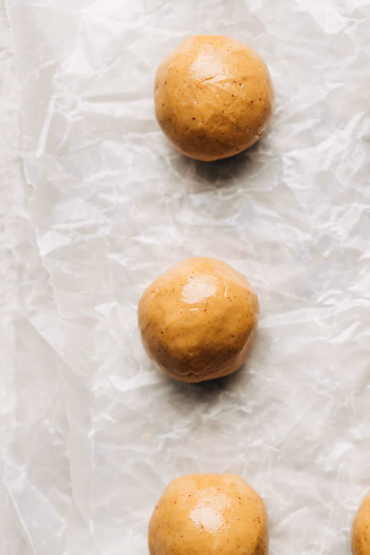 peanut butter balls on wax paper