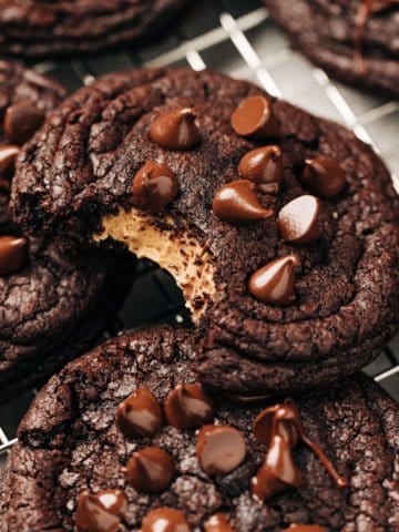 bite shot of a peanut butter stuffed chocolate cookie
