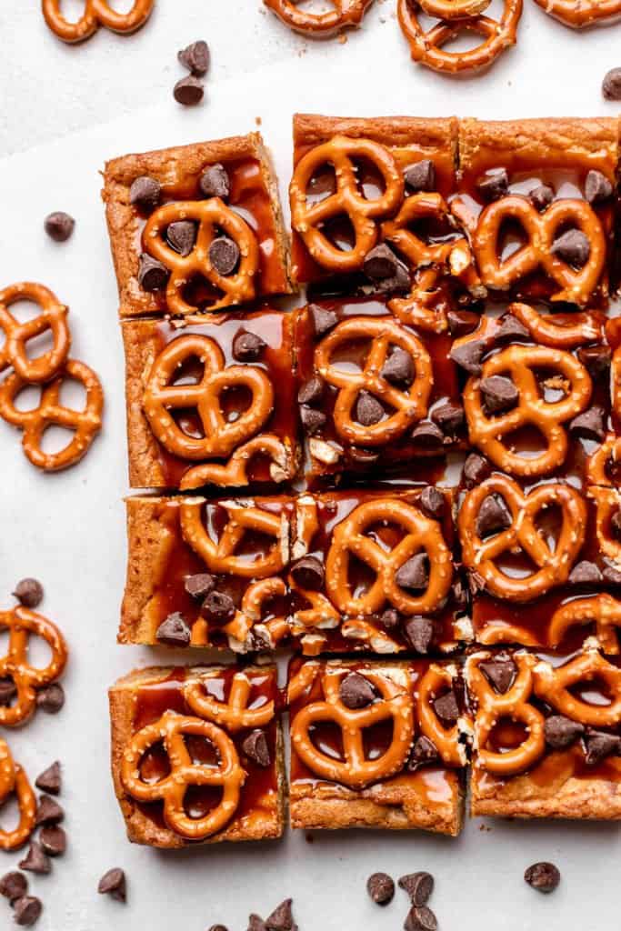 blondies with caramel sauce, pretzels, and chocolate chips