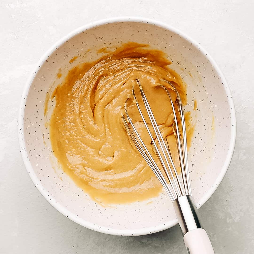 cadbury egg chocolate chip cookie wet ingredients in a mixing bowl.