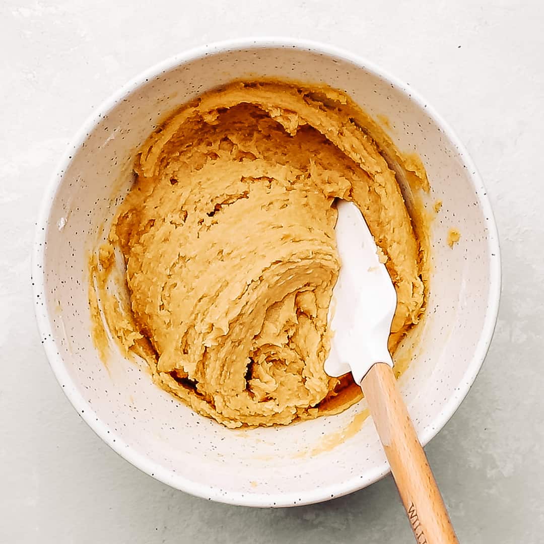 cadbury mini egg cookie dough in a mixing bowl.