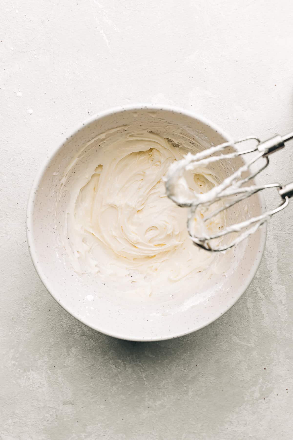 cream cheese frosting in a mixing bowl.
