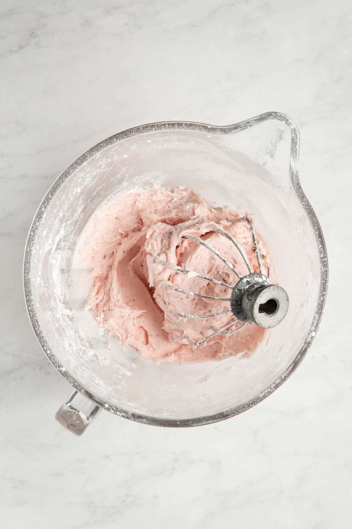 Strawberry Cream Cheese Frosting in a glass mixing bowl.