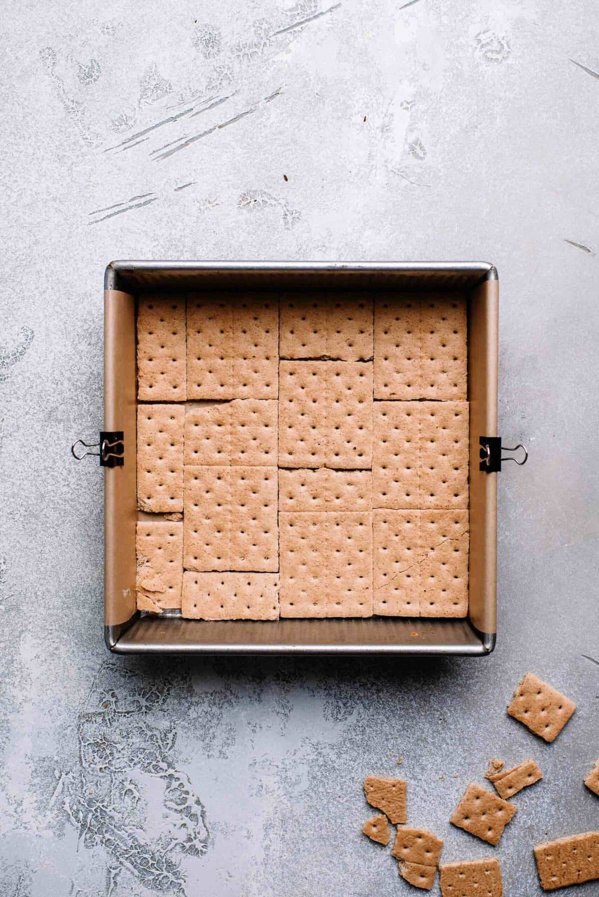 Graham crackers arranged in a baking pan.