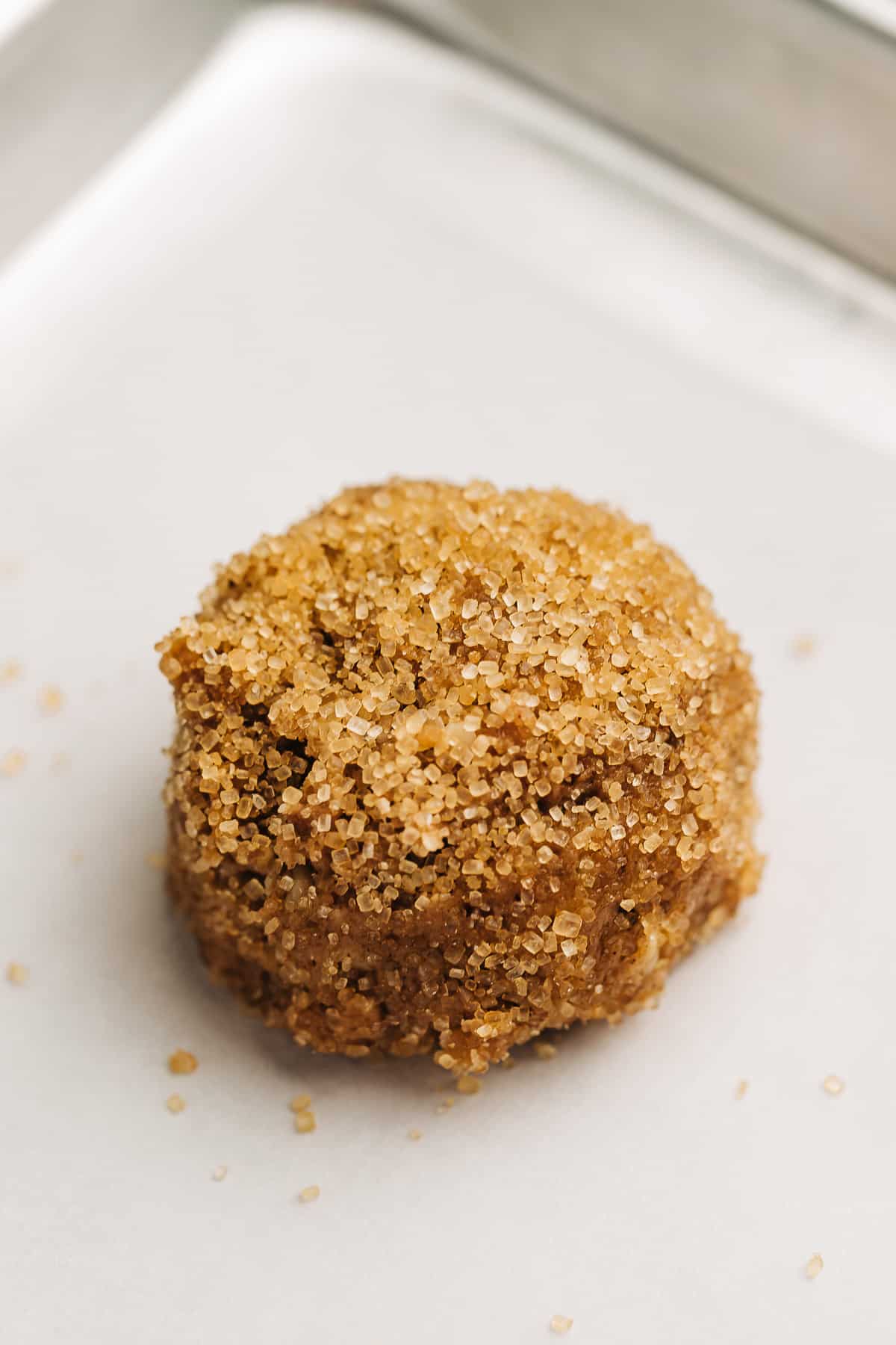 unbaked spice cookie on a baking sheet.