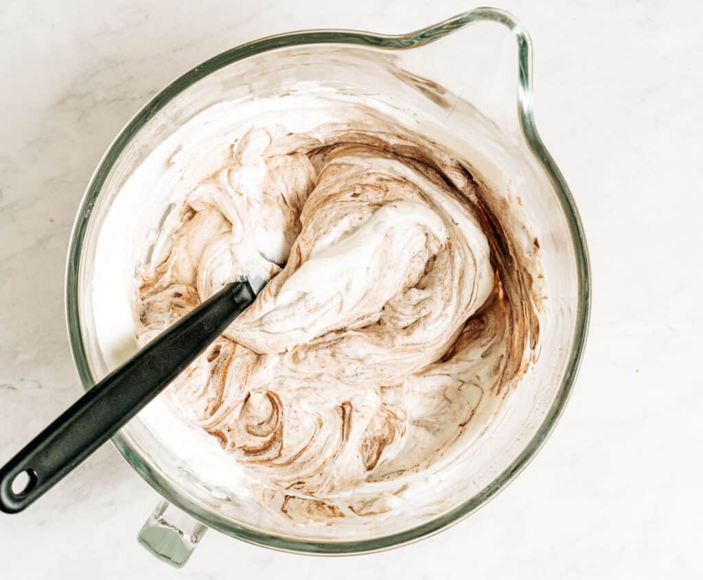 Whipped cream folded into chocolate peanut butter mixture.