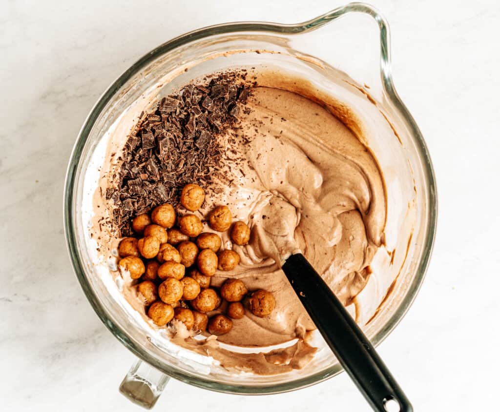 Fold in the buckeye cookie dough balls and chopped chocolate. 