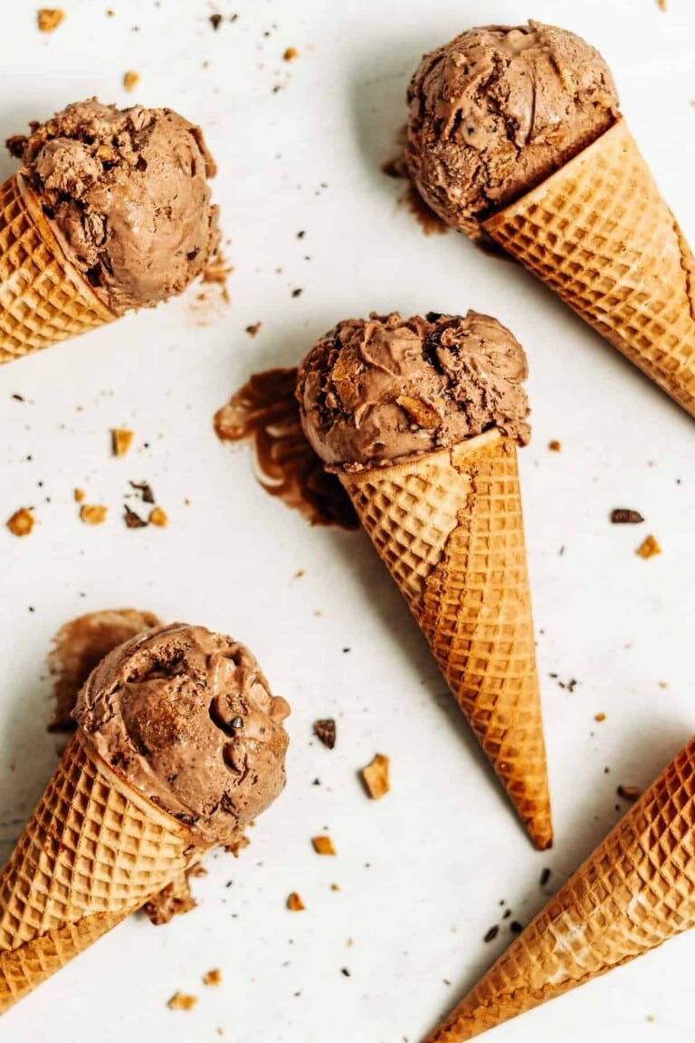 Scoops of chocolate peanut butter ice cream in cones.