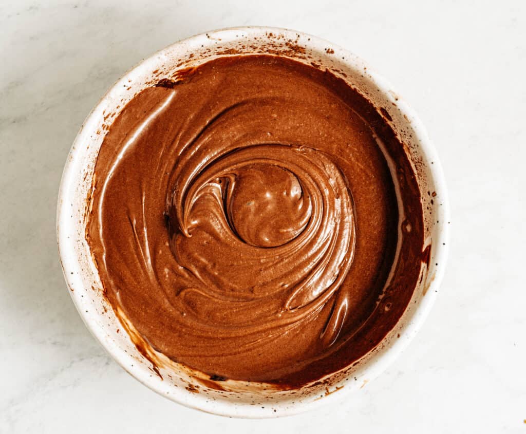 In a separate bowl, combine peanut butter, sweetened condensed milk, cocoa powder, vanilla, and salt until smooth.