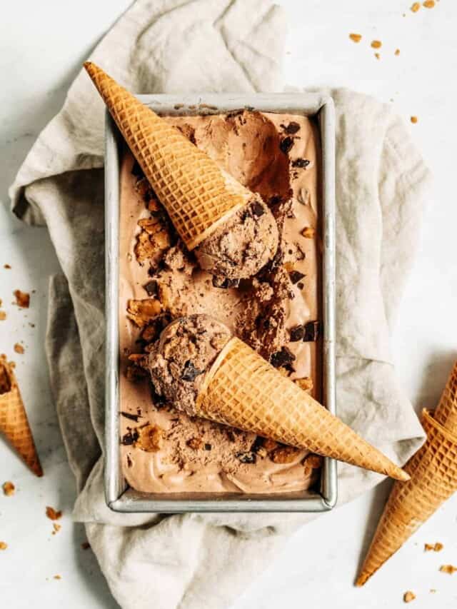 Chocolate peanut butter ice cream in a pan with two cones.