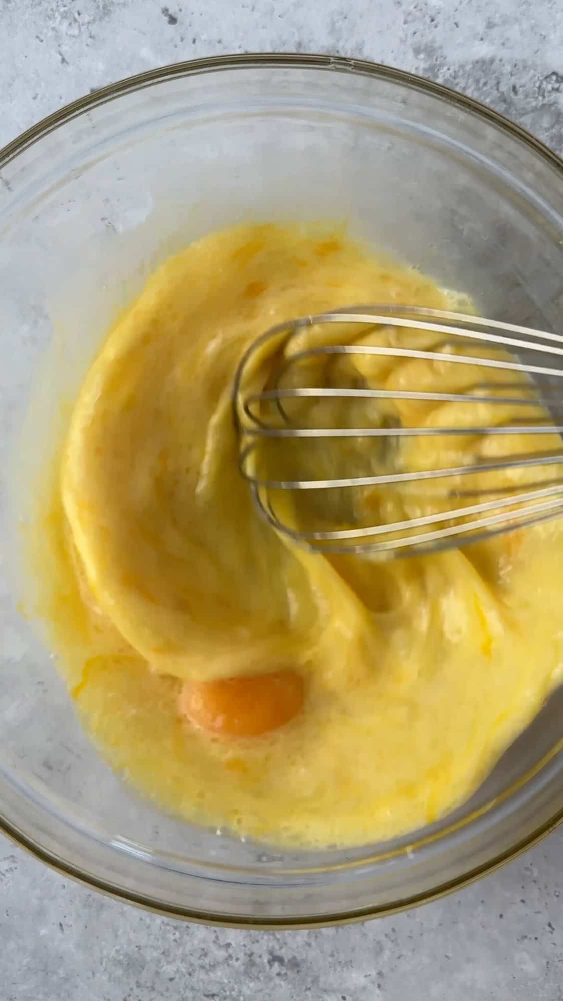 eggs and oil whisked in bowl.