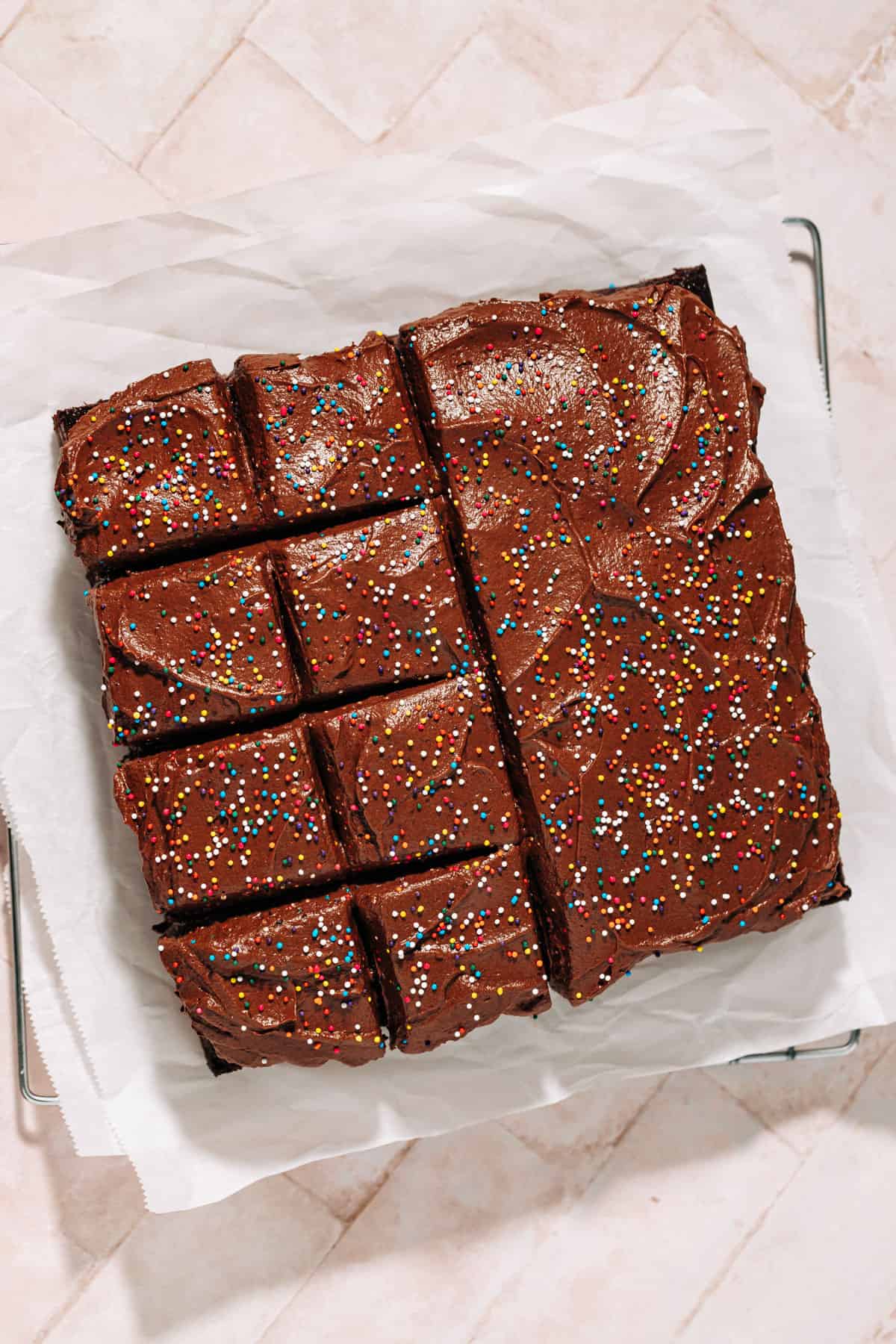 one layer chocolate cake topped with chocolate frosting and sprinkles.