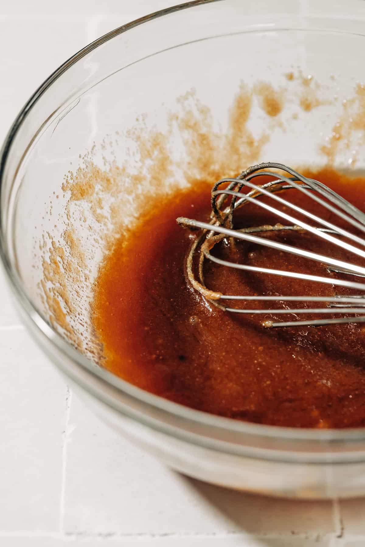 melted butter and brown sugar in a mixing bowl.