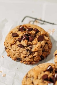 oatmeal chocolate chip cookie on a wire rack.