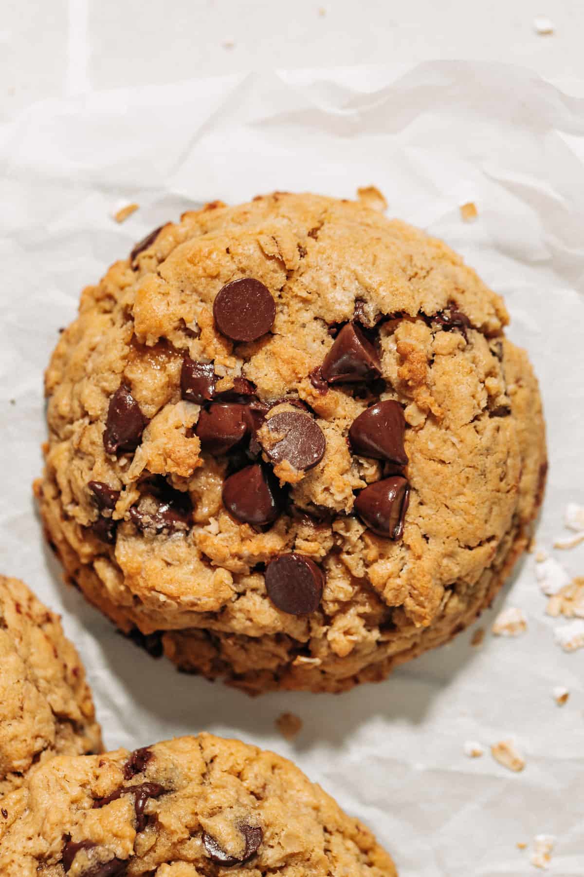 oatmeal chocolate chip cookie on parchment paper.