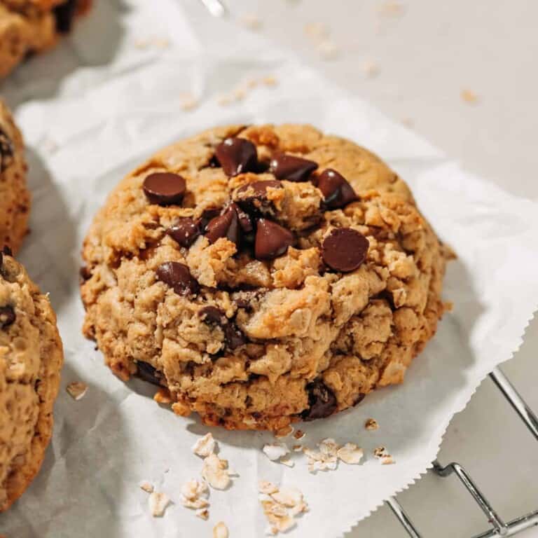 oatmeal chocolate chip cookie on parchment paper.