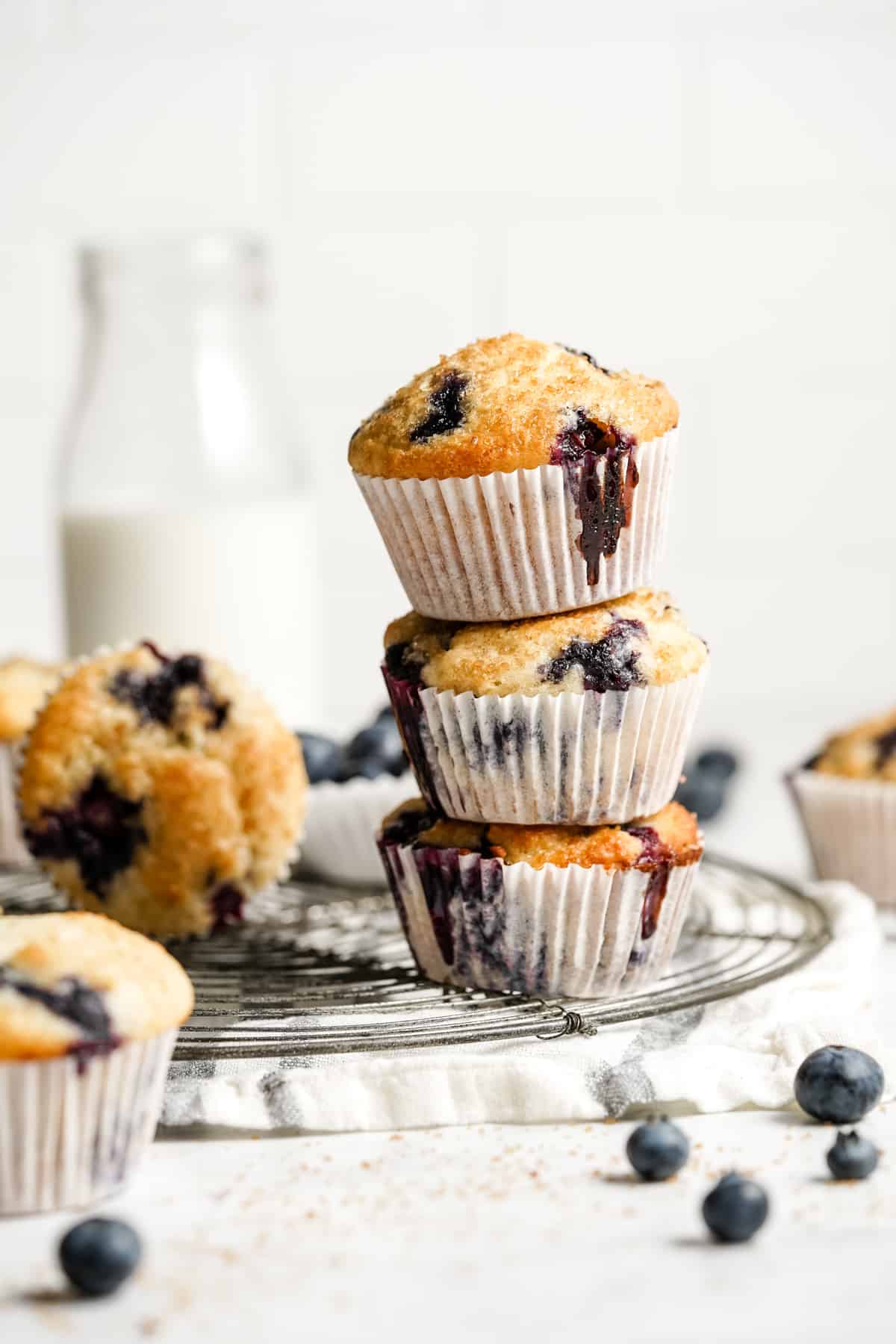 a stack of 3 blueberry muffins.