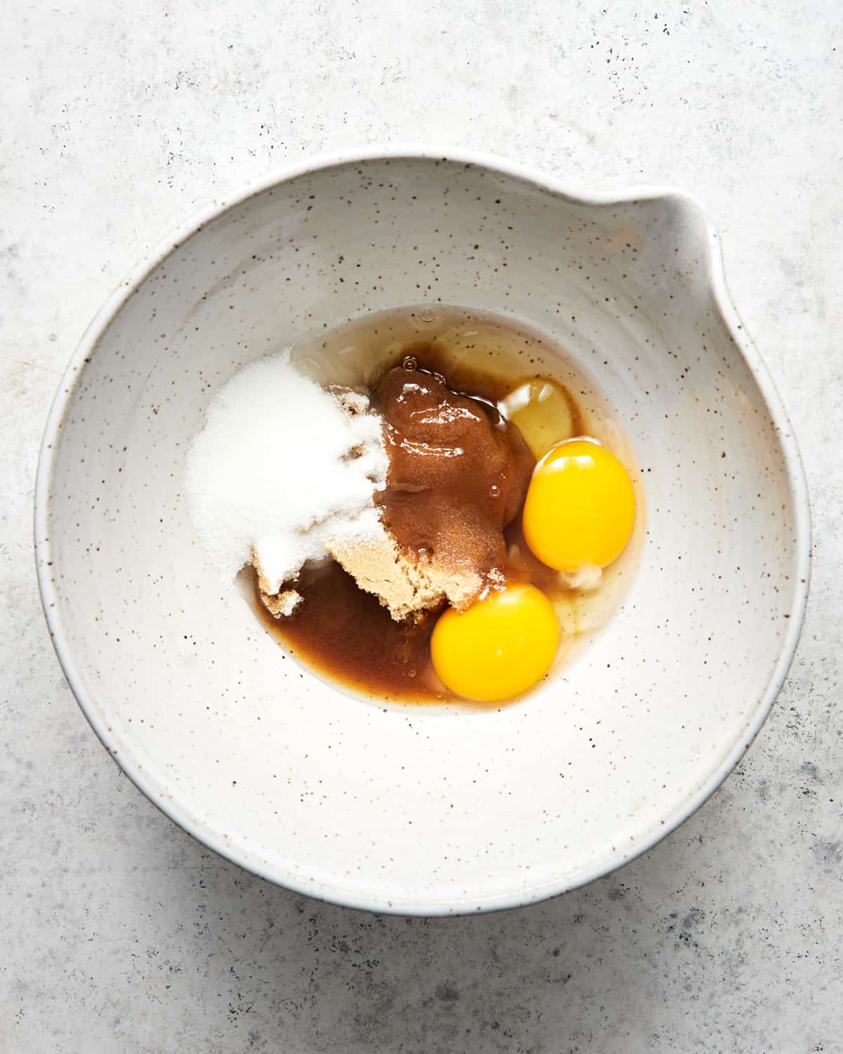 eggs and sugar in a bowl.