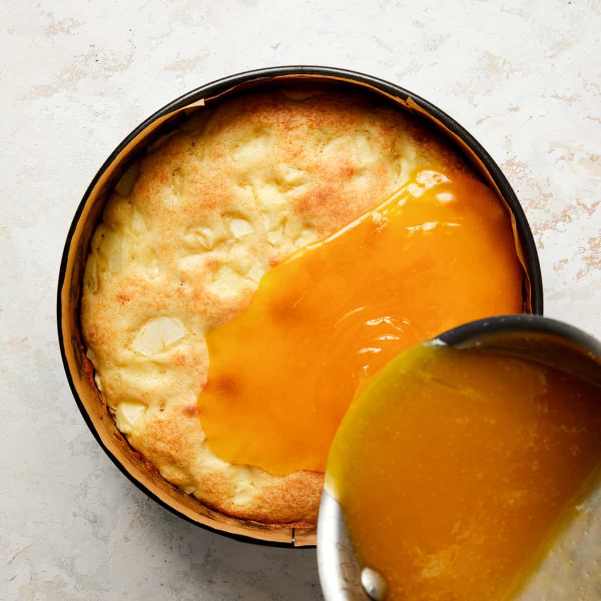 topping poured over french apple cake.