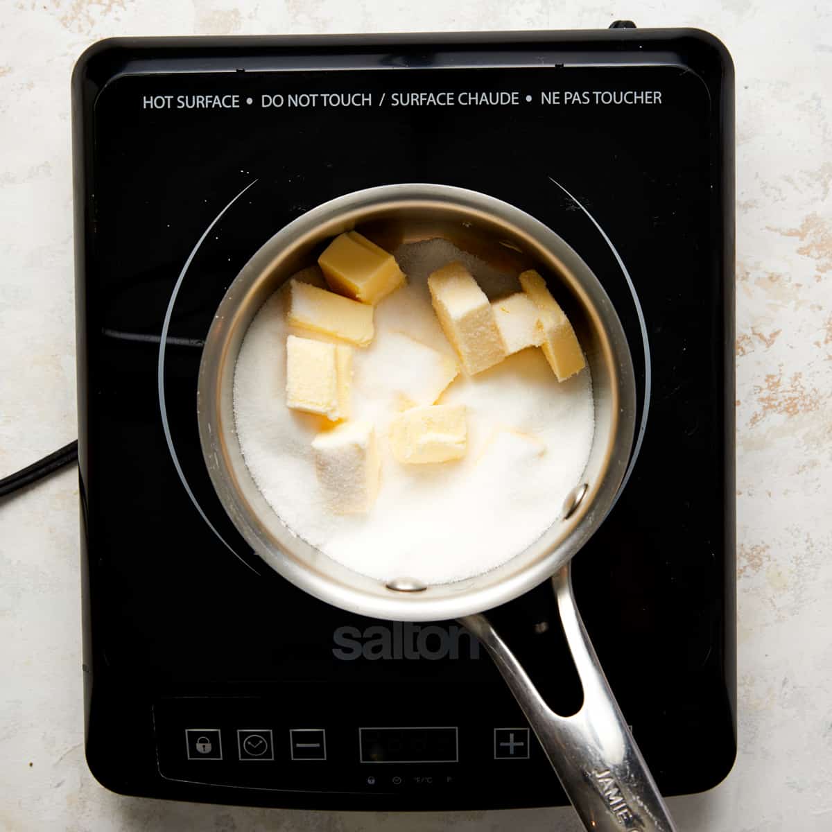 butter and sugar in a saucepan.