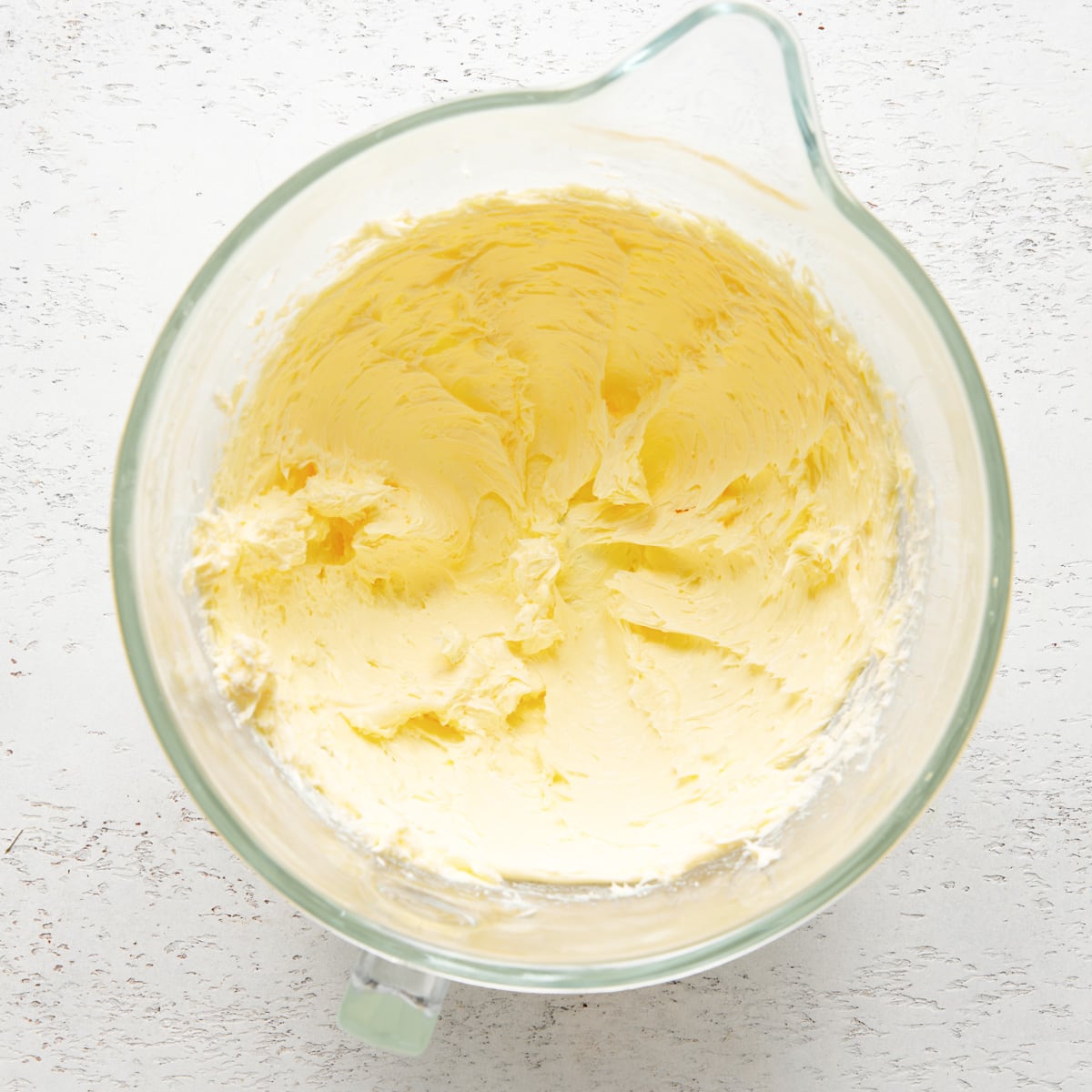 creamed butter in a mixing bowl.