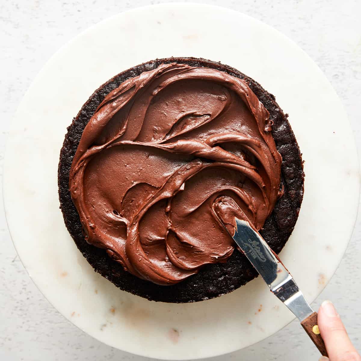 assembling chocolate cake.